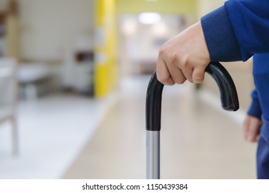 Female patient are training with walking sticks in the hospital. Image with copy space - Shutterstock ID 1150439384