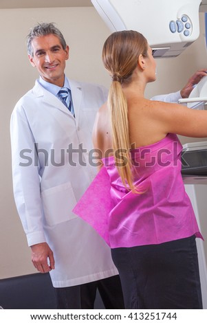 Female patient undergoing mammography test in hospital.