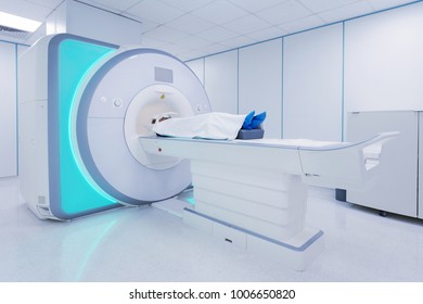 Female patient undergoing MRI - Magnetic resonance imaging in Hospital. Medical Equipment and Health Care.