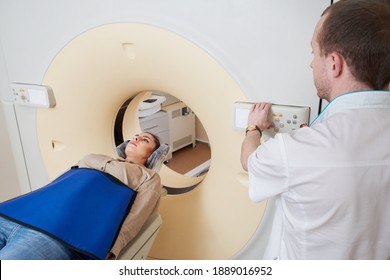 Female patient undergoing MRI - Magnetic resonance imaging in Hospital. Medical Equipment and Health Care concept