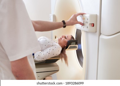 Female Patient Undergoing MRI - Magnetic Resonance Imaging In Hospital. Medical Equipment And Health Care Concept