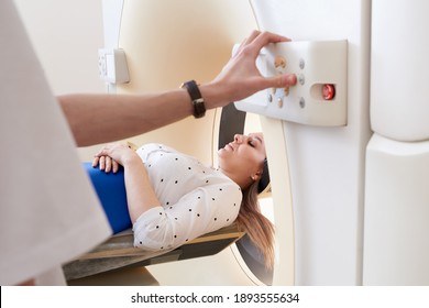 Female Patient Undergoing MRI - Magnetic Resonance Imaging In Hospital. Medical Equipment And Health Care Concept