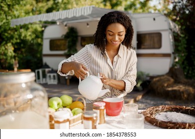 Female Person Cooking Breakfast Near Rv, Camping