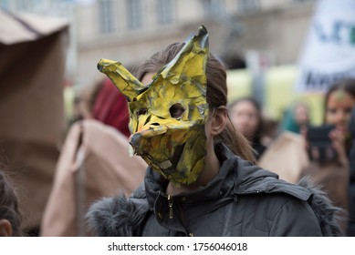 Female Person Wearing A Mouse Mask For Carnival In Public