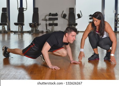 Female Personal  Trainer Working With Her Trainee