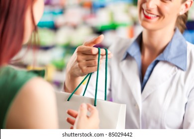 Female Pharmacist With A Female Customer In Her Pharmacy
