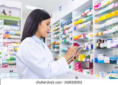 Female pharmacist using computer tablet for check prescription. Health care and medical concept. - Powered by Shutterstock