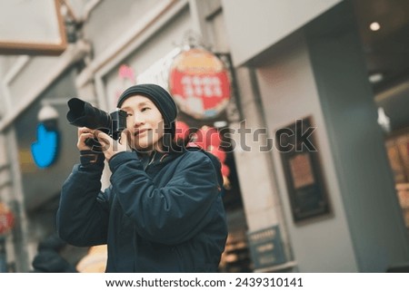 Female Photographer Capturing Urban Street Life