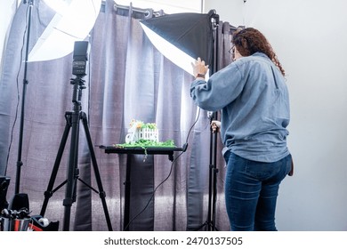 Female Photographer Making a Shooting with a Camera in a Professional Studio. - Powered by Shutterstock