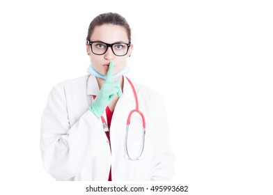 Female Physician With Eyeglassess Doing Shush Gesture As Silence Or Secret Concept Isolated On White With Text Area