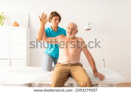 Similar – Image, Stock Photo A female physiotherapist performs stretches on the neck of her patient, an elderly man, to aid in his rehabilitation and wellbeing