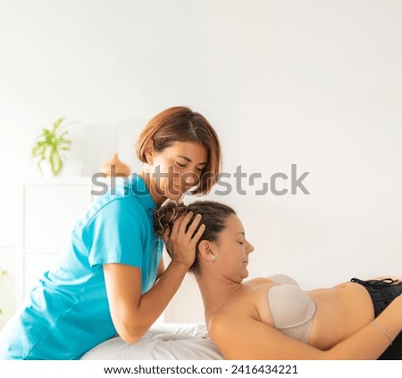 Similar – Image, Stock Photo A female physiotherapist performs stretches on the neck of her patient, an elderly man, to aid in his rehabilitation and wellbeing