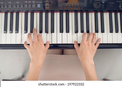 Female Piano Player, View From The Top, Body And Buttons Of The Piano Were Digitally Modified