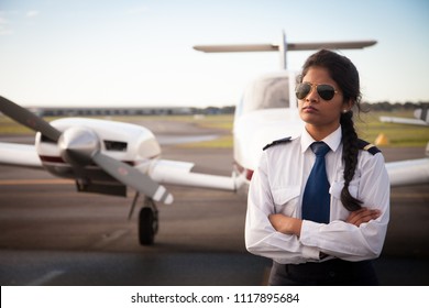 Female Pilot By Her Aircraft