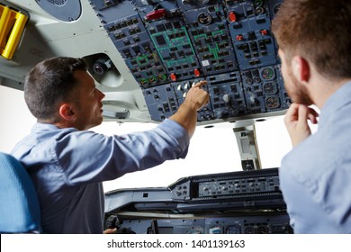 female pilot the captain of the plane prepares for take-off - Powered by Shutterstock