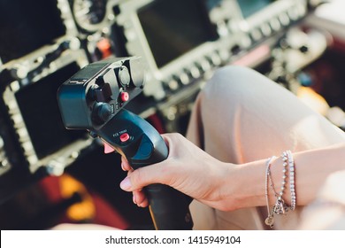 Female Pilot In Cockpit Of Helicopter Before Take Off. Young Woman Helicopter Pilot.