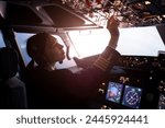 A female pilot controls a large passenger plane