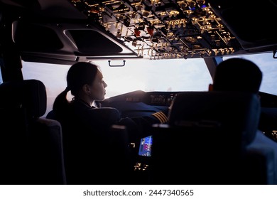 A female pilot controls a large passenger plane