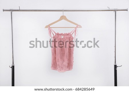 female pink vest on hanging

