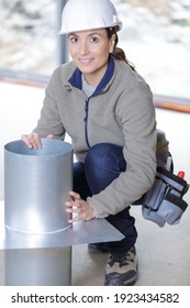 Female Plumber Installing Air Pipes