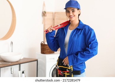 Female Plumber With Tools In Bathroom