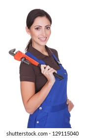 Female Plumber With A Wrench. Isolated On White