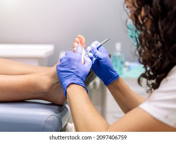 Female Podiatrist Doing Chiropody In Her Podiatry Clinic. Selective Focus