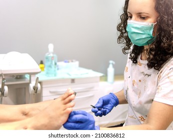 Female Podiatrist Doing Chiropody In Her Podiatry Clinic. Selective Focus