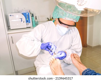 Female Podiatrist Doing Chiropody In Her Podiatry Clinic. Selective Focus