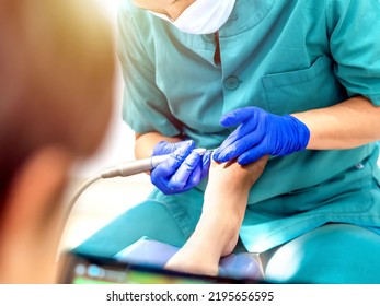 Female Podiatrist Doing Chiropody In Her Podiatry Clinic. Selective Focus