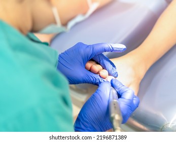 Female Podiatrist Doing Chiropody In Her Podiatry Clinic. Selective Focus