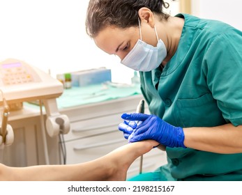 Female Podiatrist Doing Chiropody In Her Podiatry Clinic. Selective Focus