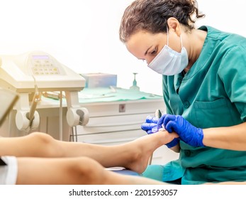 Female Podiatrist Doing Chiropody In Her Podiatry Clinic. Selective Focus