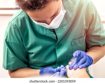 Female Podiatrist Doing Chiropody In Her Podiatry Clinic. Selective Focus