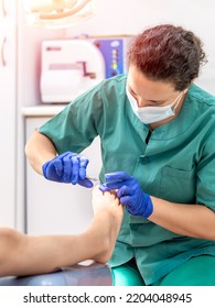 Female Podiatrist Doing Chiropody In Her Podiatry Clinic. Selective Focus