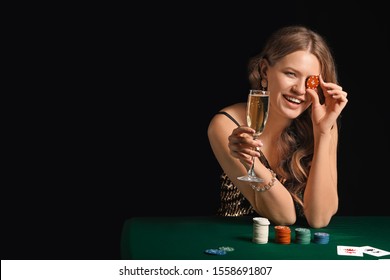 Female Poker Player At Table In Casino