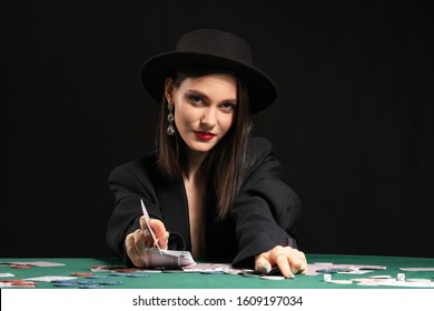 Female Poker Player At Table In Casino