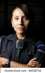 A Female Police Officer Posing For Her Portrait At Night.