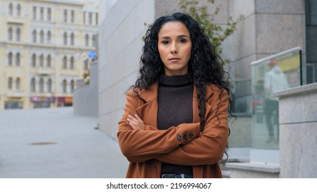 Female Portrait Beautiful Latin Business Woman Look Over Shoulder Young Hispanic Serious Girl Brunette Student Model Tourist Turn Turning Standing City Background Looking At Camera Arms Crossed Posing