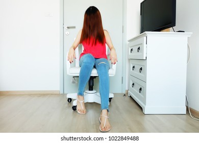 Female Portrait Brown Hair Covered Her Face. Beautiful Woman Wearing Red Shirt, Lack of Jeans and Shoes Sitting on a White Chair in the Room White Studio Background Great for Any Use. - Shutterstock ID 1022849488