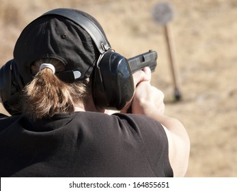 Female practicing target shooting.
