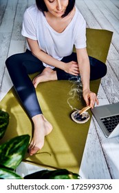 Female Practicing Yoga In Quarantine At Home. National Yoga Day. Healthy Living In Lockdown. Using For Meditation Palo Santo Sticks.