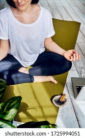 Female Practicing Yoga In Quarantine At Home. National Yoga Day. Healthy Living In Lockdown. Using For Meditation Palo Santo Sticks.