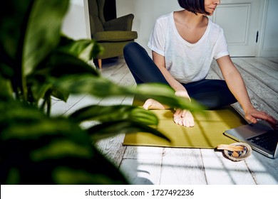 Female Practicing Yoga In Quarantine At Home. National Yoga Day. Healthy Living In Lockdown. Using For Meditation Palo Santo Sticks.