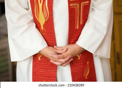 A Female Priest Is Folding Her Hands During Praying