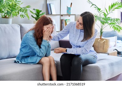 Female professional child psychologist working with preteen girl in office - Powered by Shutterstock