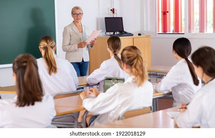 Female Professor Giving Lesson For Medical Students In Lecture Hall