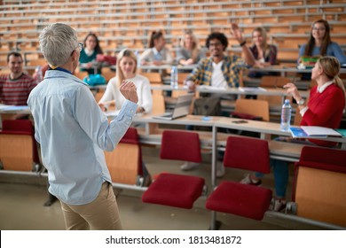 Female Professor Lecturing The Students In Amphitheatre