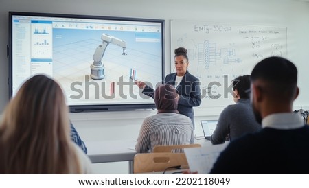Female Professor Standing Next to Interactive Whiteboard and Teaching Diverse Students Innovations in Robotics. Computer Science and Modern Technologies in Higher Education Concept. ストックフォト © 