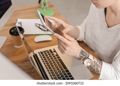 Female Programmer Using Tablet Computer In Office, Closeup